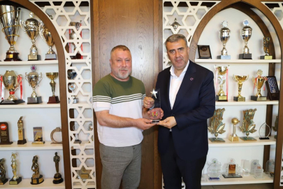 İGC’den Başka n Altan’a plaket